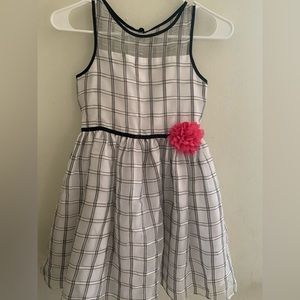 In okay conditions but no stains! Black and white striped dress